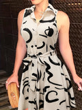 Chic Abstract Print Sleeveless Dress - Flattering Button Front & Tie-waist Detail - Stylish Lapel Collar - Ideal for Spring & Summer - Trendy Womens Clothing